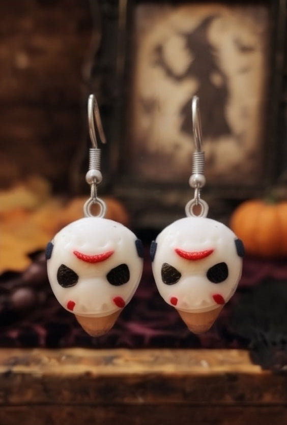 Eight pairs of Halloween-themed dangling earrings arranged in a 2x4 grid. The earrings feature various character faces including Jack Skellington, Michael Myers, Jason Voorhees, and Ghostface, some wearing black witch hats.
