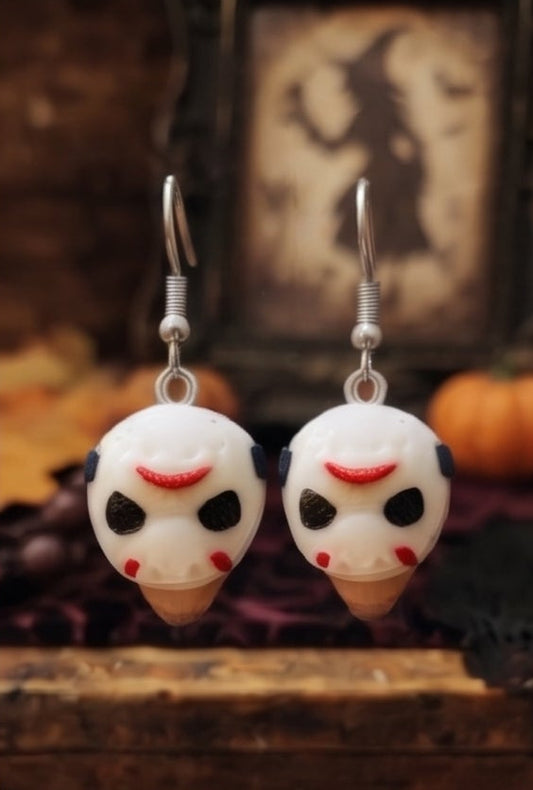 Eight pairs of Halloween-themed dangling earrings arranged in a 2x4 grid. The earrings feature various character faces including Jack Skellington, Michael Myers, Jason Voorhees, and Ghostface, some wearing black witch hats.